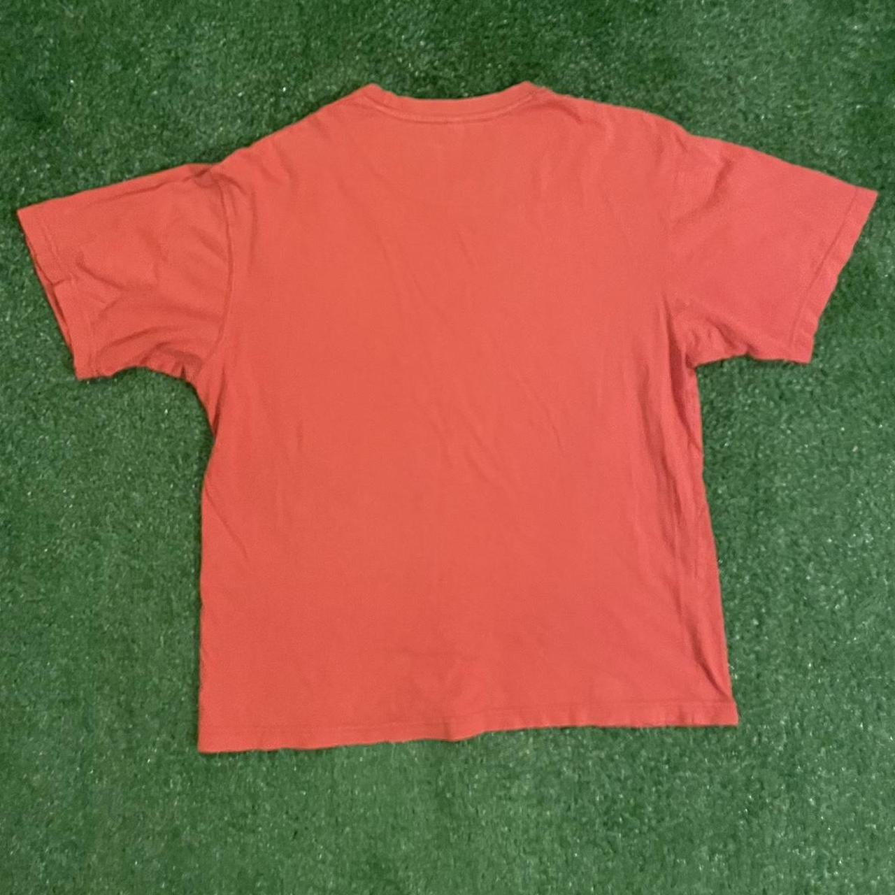 Orange Graphic Tee w/ Unique Design, Featuring a bold Hawaiian racing, eye-catching print
