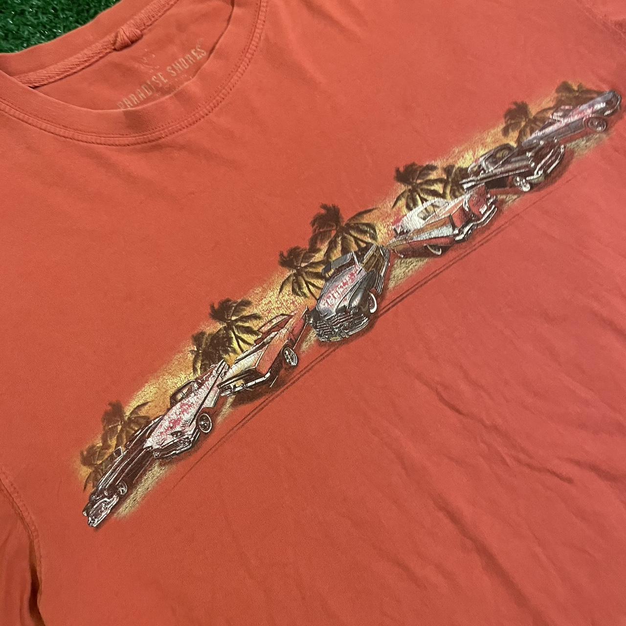 Orange Graphic Tee w/ Unique Design, Featuring a bold Hawaiian racing, eye-catching print